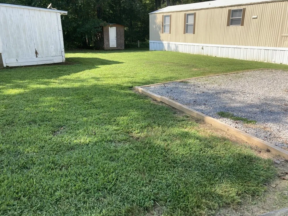 Expert lawn care service for residential properties in Henderson, NC by Cook Landscaping & Hauling