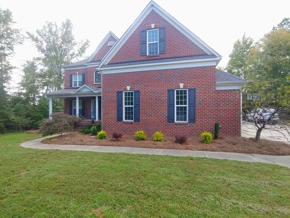 Affordable yard maintenance for residential properties in Harrisburg, NC by Cook's Lawn & Landscape