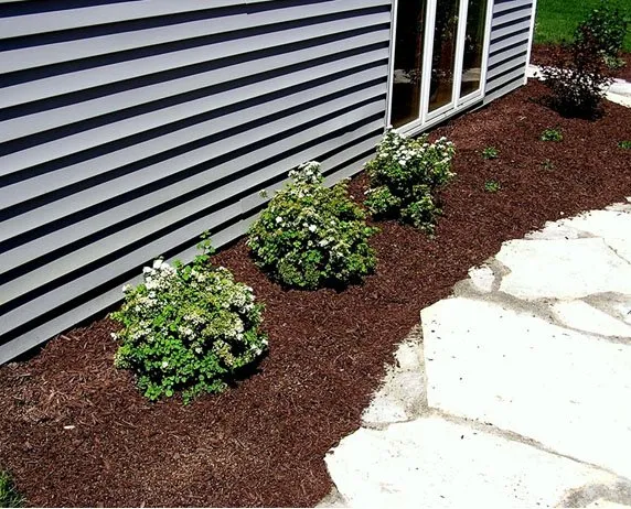 Expert outdoor landscaping in Grand Haven, MI by Coon's Quality Care Lawn Service