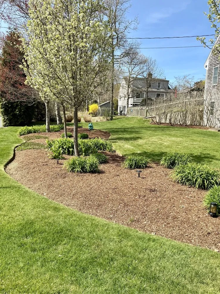Professional lawn mowing service for outdoor upgrades in Harwich, MA by Cooper Landscaping Inc