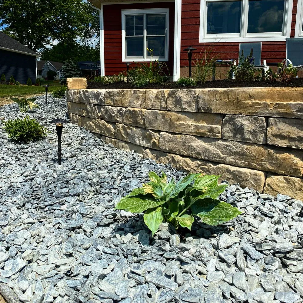 Custom outdoor landscaping for year-round maintenance in Adrian, MI by Cooper's Lawn Care