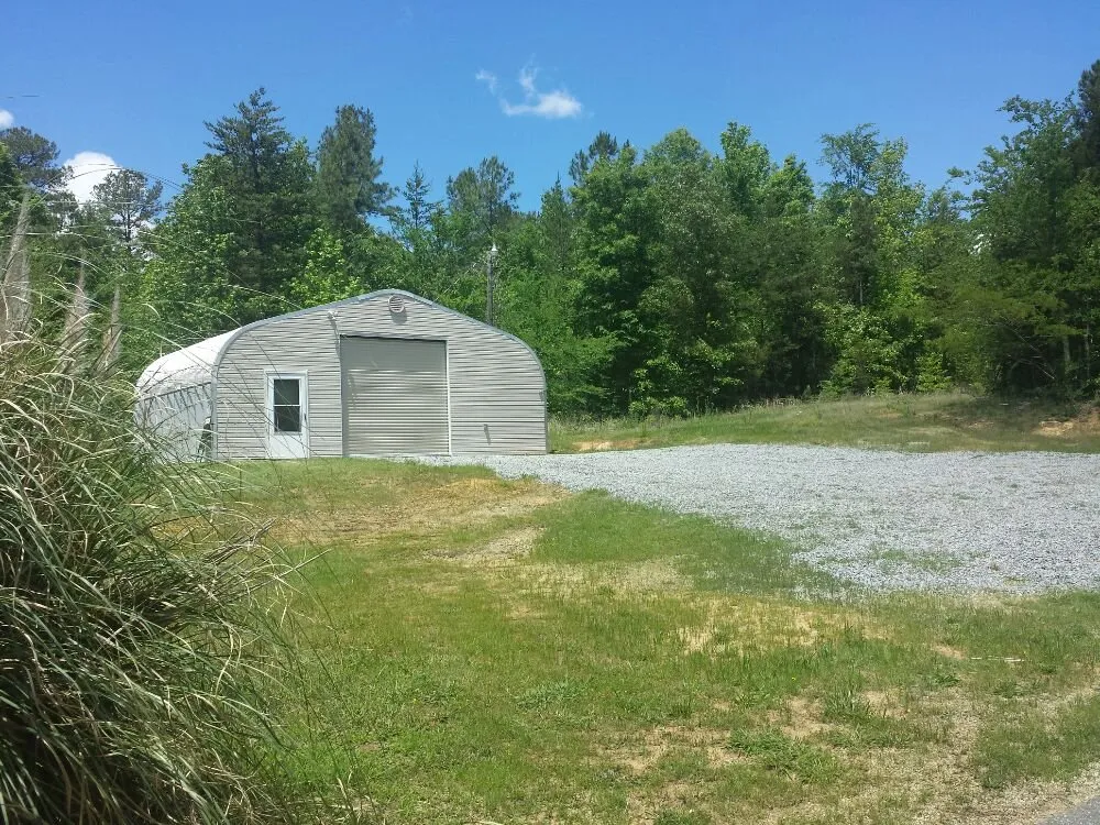 Custom lawn mowing service for outdoor upgrades in Bolivia, NC by Cordell's Remodeling and Landscaping