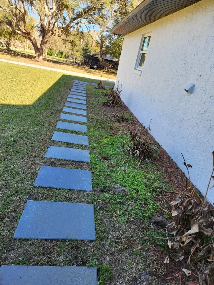 Expert lawn mowing service for residential properties in Ocala, FL by Corea Group P & I