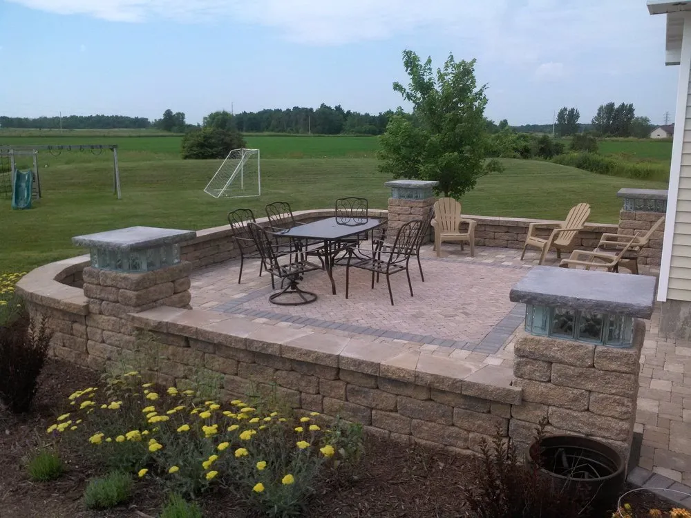 Top-rated lawn mowing service for year-round maintenance in Green Bay, WI by CornerStone Design