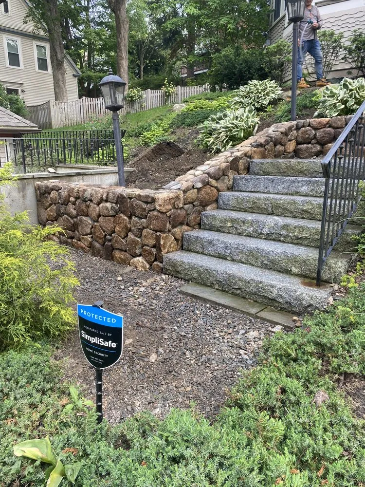 Trusted lawn mowing service for residential properties in Framingham, MA by Corona and Sons Landscaping