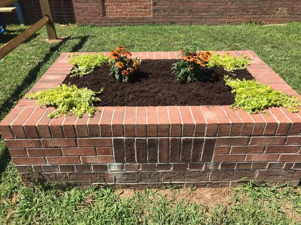 Affordable yard cleanup service for year-round maintenance in Fredericksburg, VA by Cottage Gardens Landscaping & Power washing