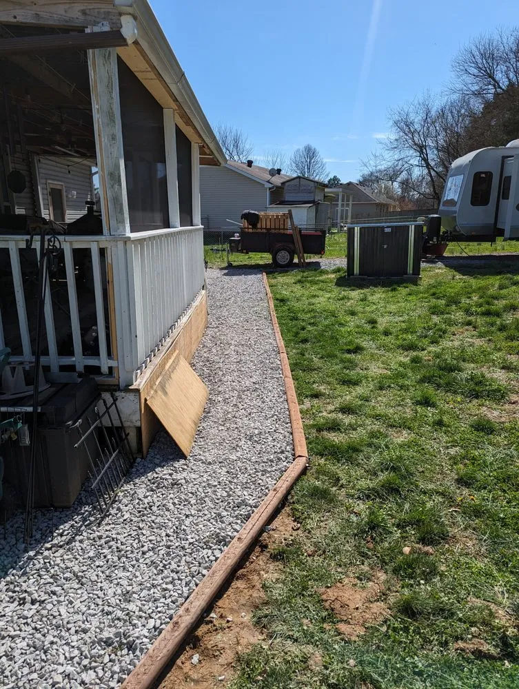 Professional landscape design with custom design in Woodlawn, TN by Country Boy Lawn Care Landscaping and Junk Removal