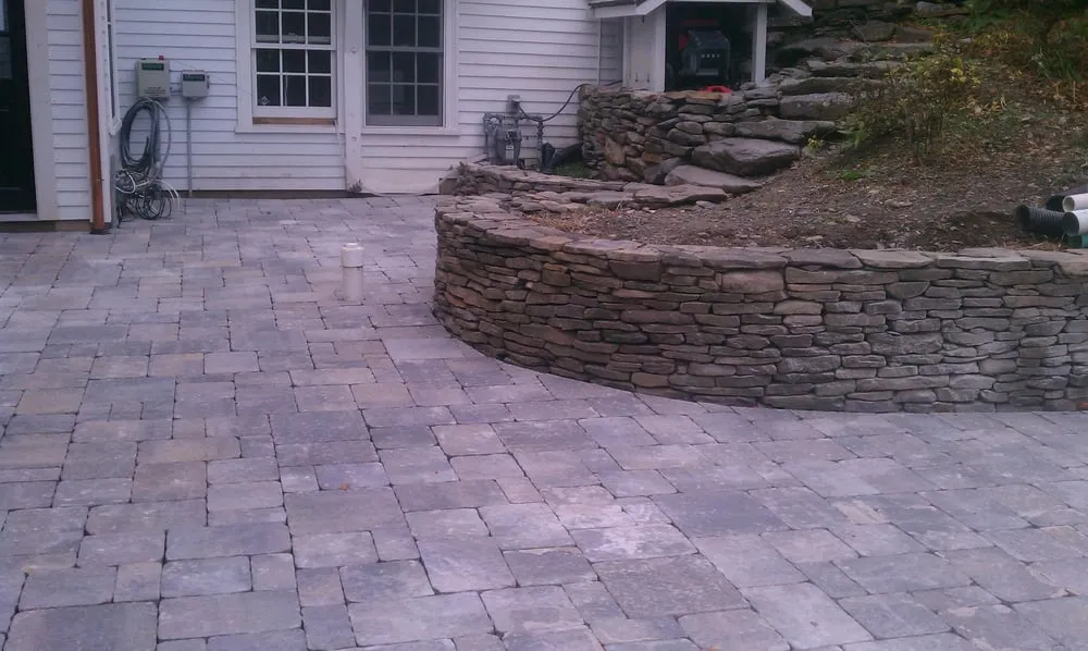 Custom landscape installation with custom design in Essex, MA by CPC Landscape Contractors