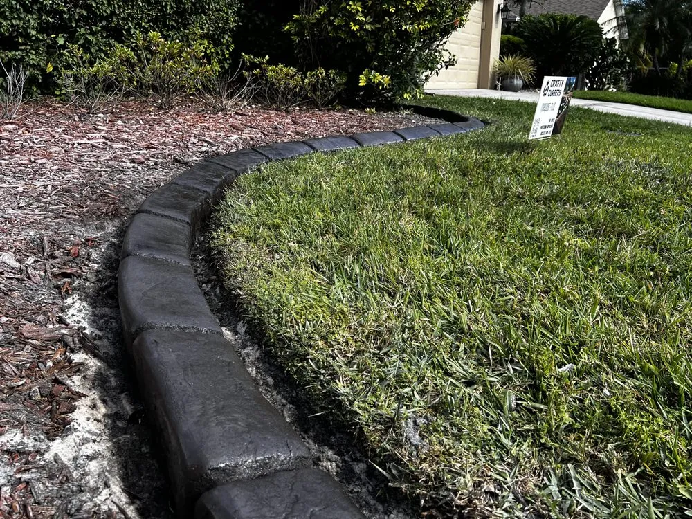 Affordable outdoor landscaping for year-round maintenance in Orlando, FL by Crafty Curbers