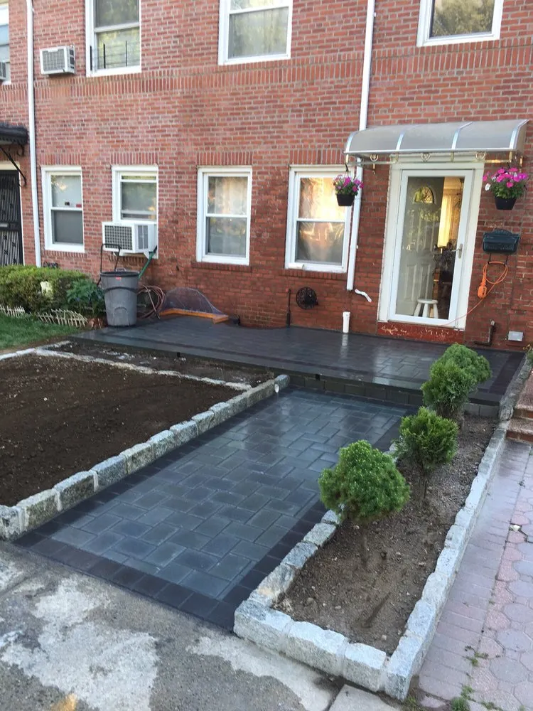 Professional outdoor landscaping for residential properties in Westbury, NY by Creative Contracting