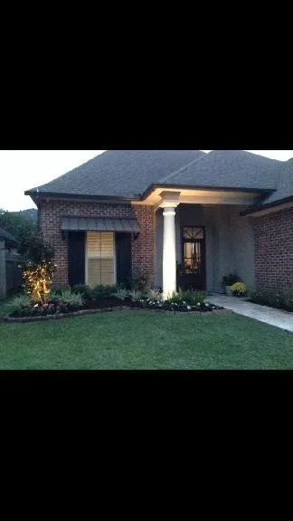 Custom lawn care service for homes in Lafayette, LA by Creative Exteriors