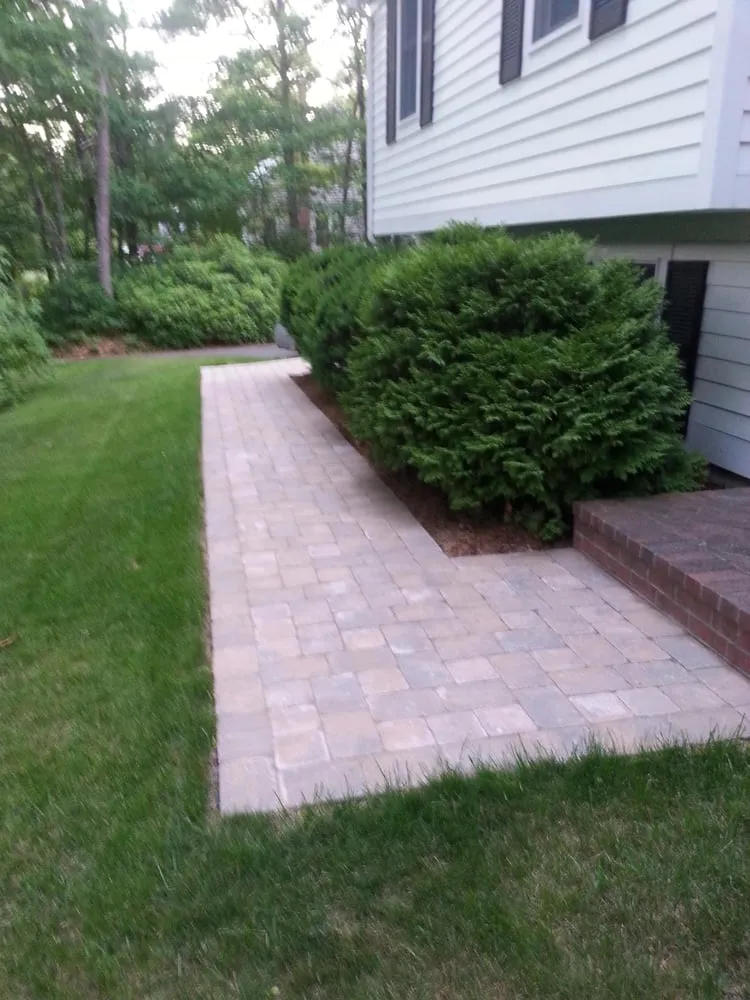 Professional yard maintenance for year-round maintenance in East Falmouth, MA by Creative Masonry and Landscape