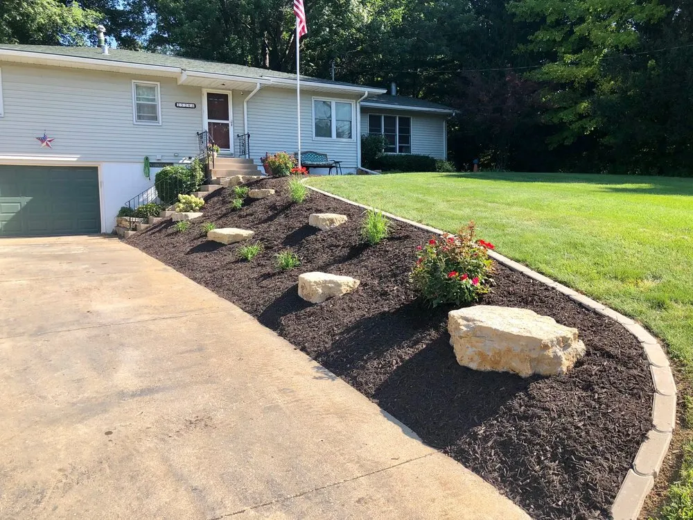 Expert yard cleanup service with custom design in Bettendorf, IA by Creative Outdoors