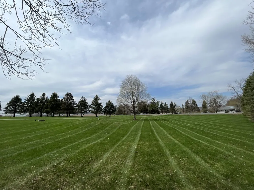 Expert lawn mowing service with custom design across River Falls, WI - CRM Services