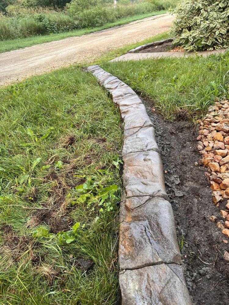 Affordable lawn mowing service for homes in Prescott, WI by Croix Valley Curbing and Landscaping