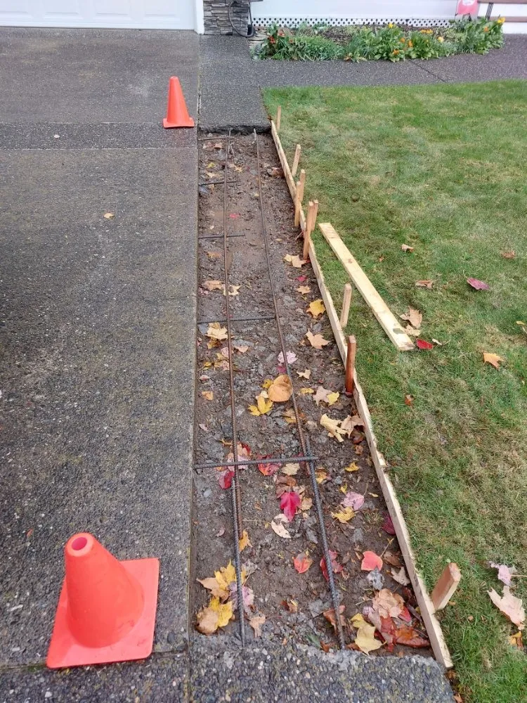 Affordable lawn care service for residential properties in Lynden, WA by Cummings Concrete