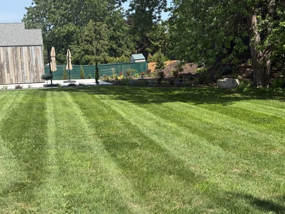 Custom lawn mowing service for residential properties in De Pere, WI by Cure Lawn Care