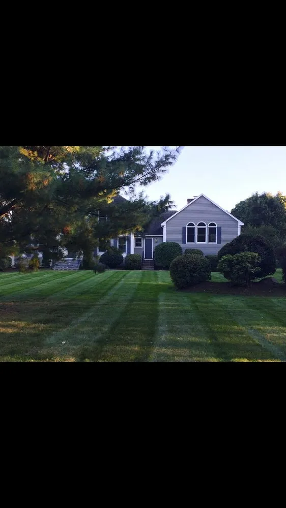 Custom lawn mowing service for year-round maintenance in Andover, MA by Currivan Green