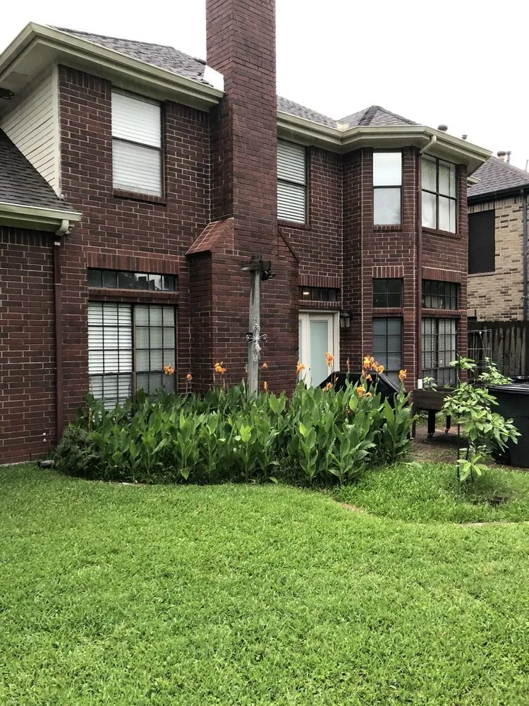 Custom lawn mowing service in League City, TX by Custom Courtyards Design and Landscaping