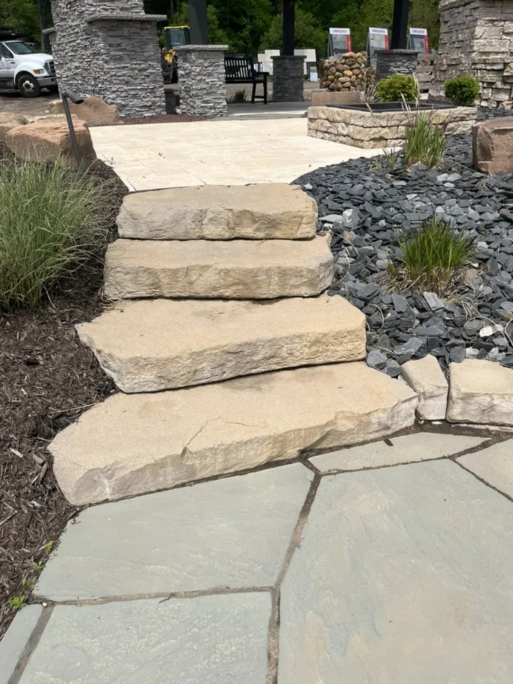 Local landscape installation with custom design across Crown point, MI - Custom Creeks