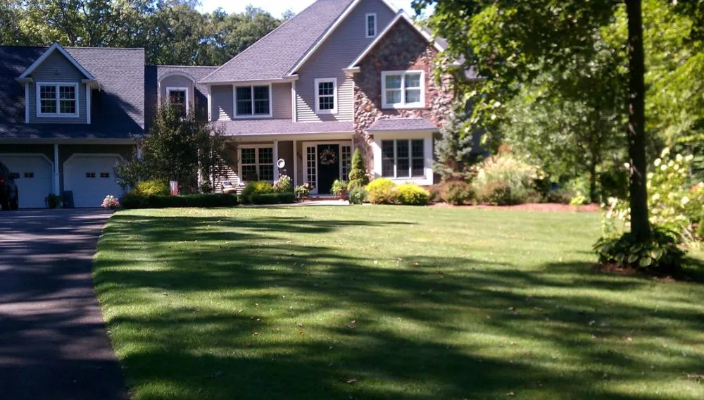 Affordable lawn care service with custom design in Prospect, CT by Custom Grounds