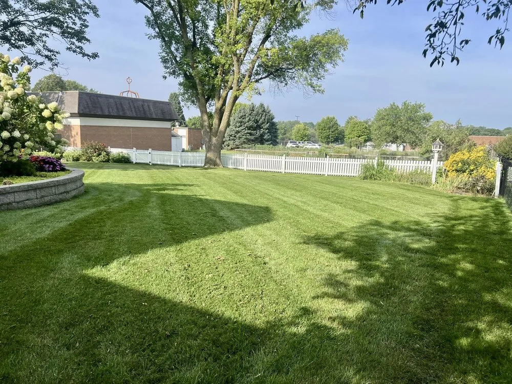 Top-rated lawn mowing service in Cumming, IA by Custom Outdoor Services