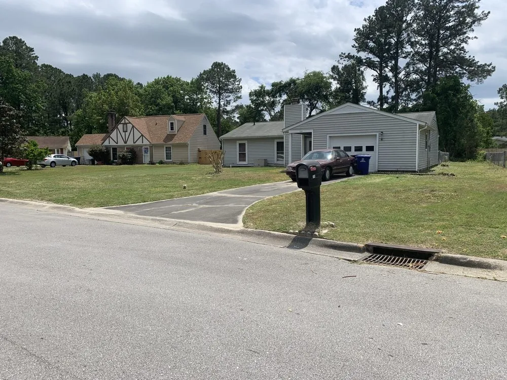 Custom lawn mowing service for homes in Jacksonville, NC by Cut The World Lawncare