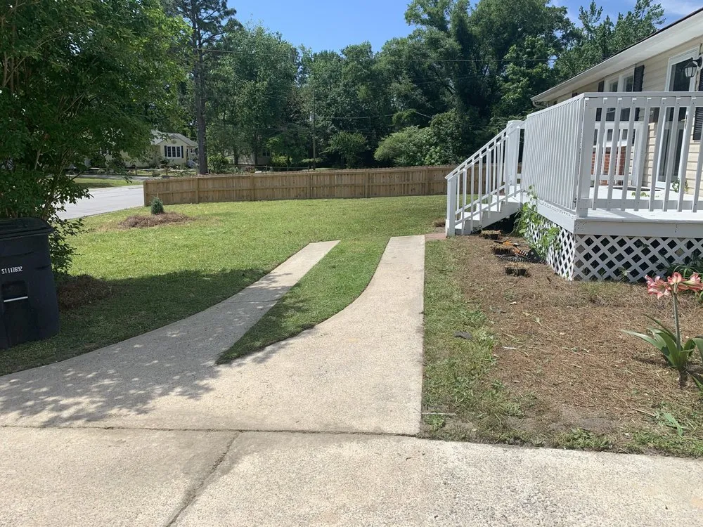 Custom landscape installation for residential properties in Jacksonville, NC by Cut The World Lawncare