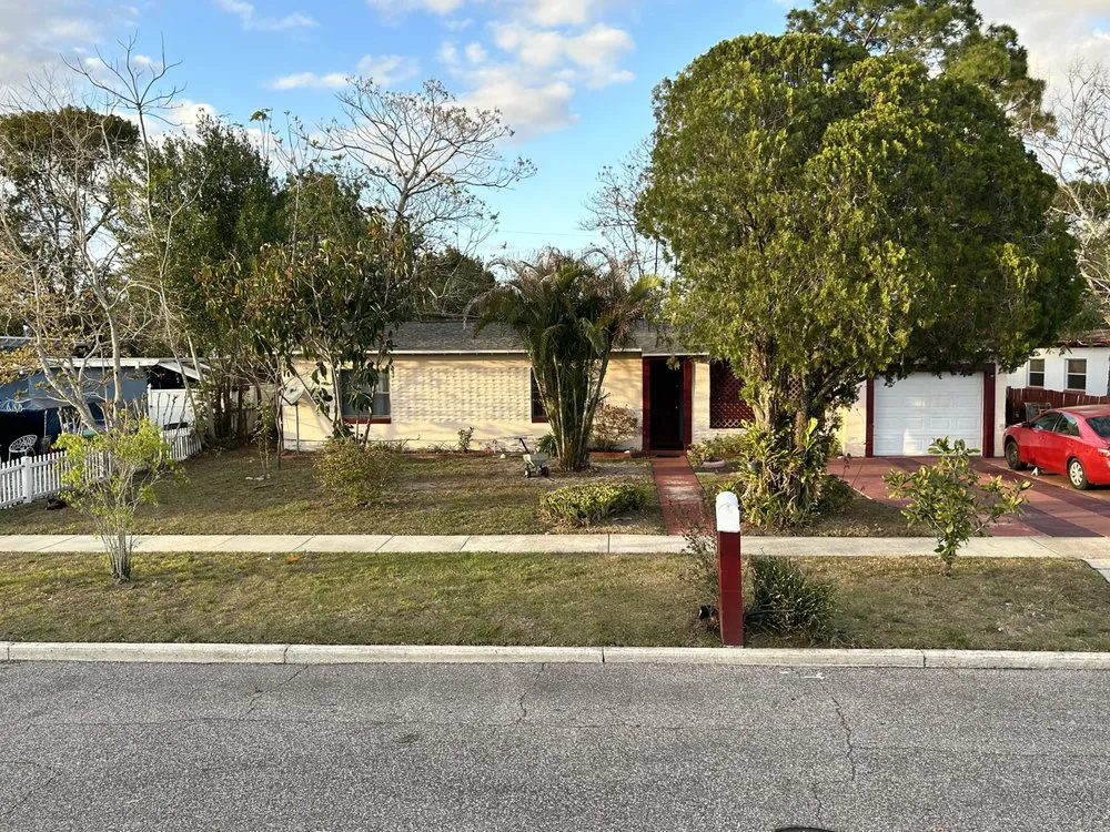 Professional yard cleanup service for residential properties in Orlando, FL by Cut2Clean LLC