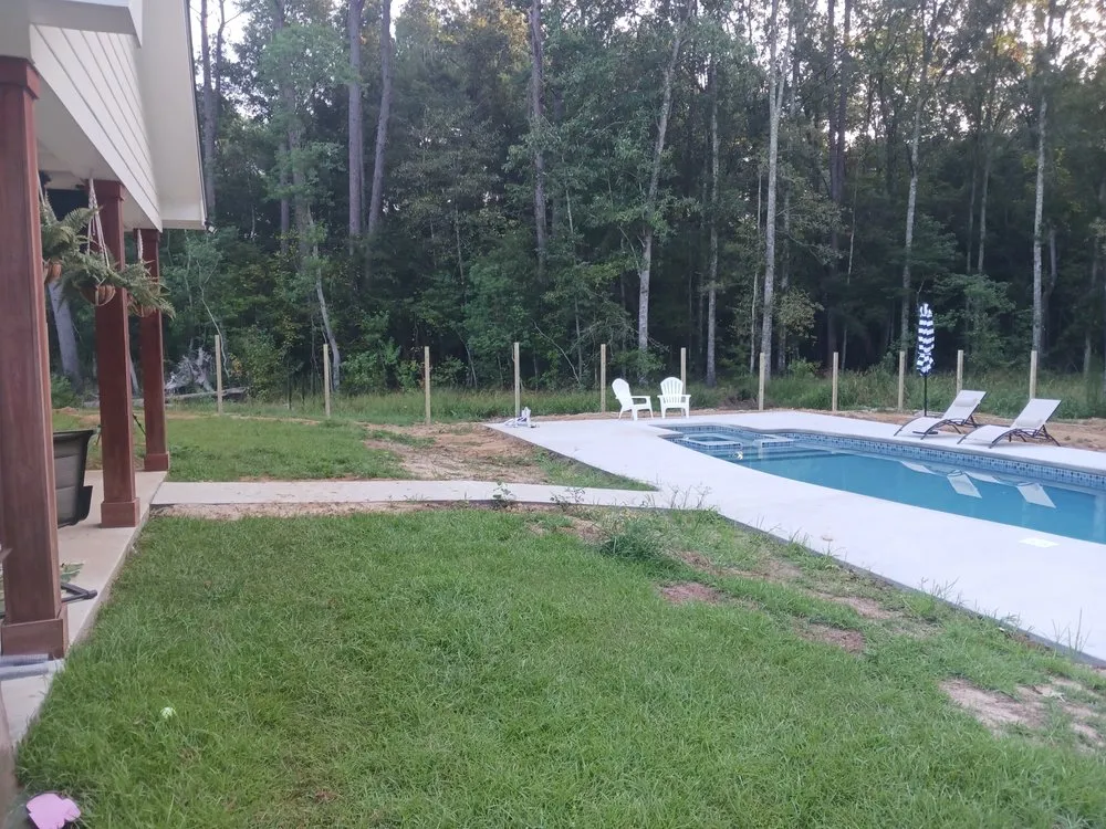 Professional outdoor landscaping for residential properties across Watson, LA - Cute Aza Button Fence and Lawn