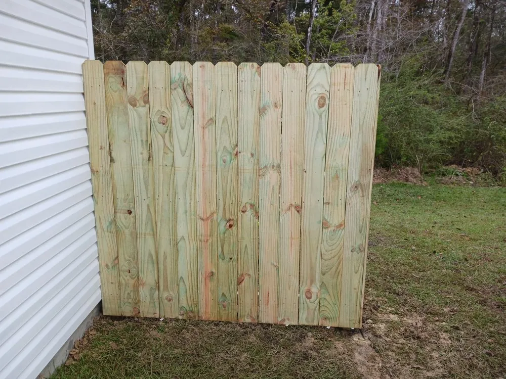 Expert landscape design in Watson, LA - Cute Aza Button Fence and Lawn