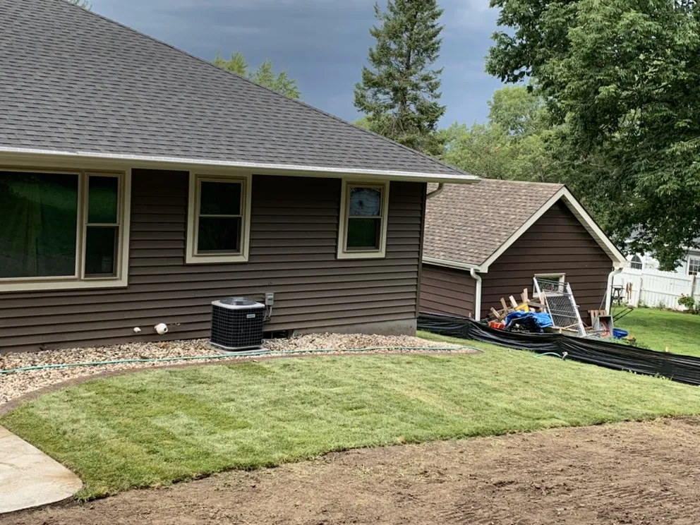 Affordable yard cleanup service with custom design in Ogdensburg, WI by Cutting Edge Lawn Care & Landscaping