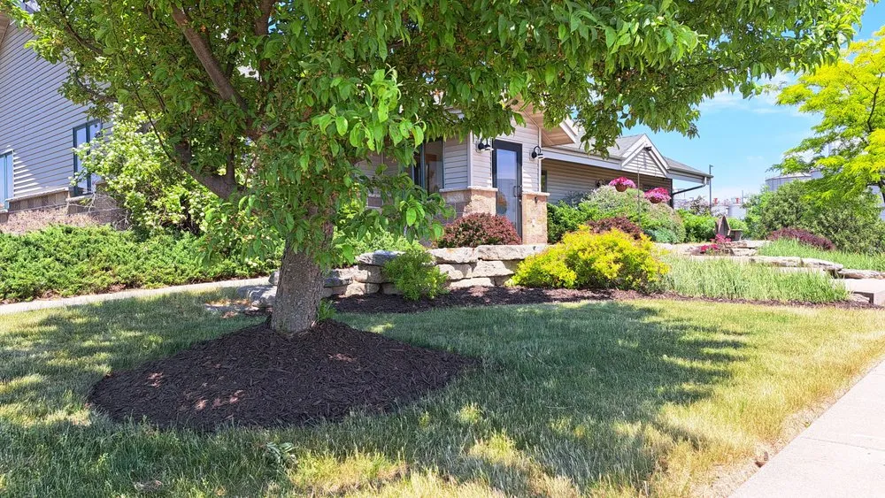 Custom landscape design for residential properties in Cambria, WI by Cutting Edge Lawn Services