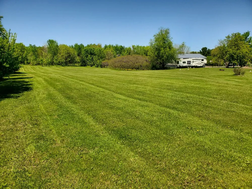 Local landscape installation with custom design in Cameron, WI by Cutting Edge Lawn's