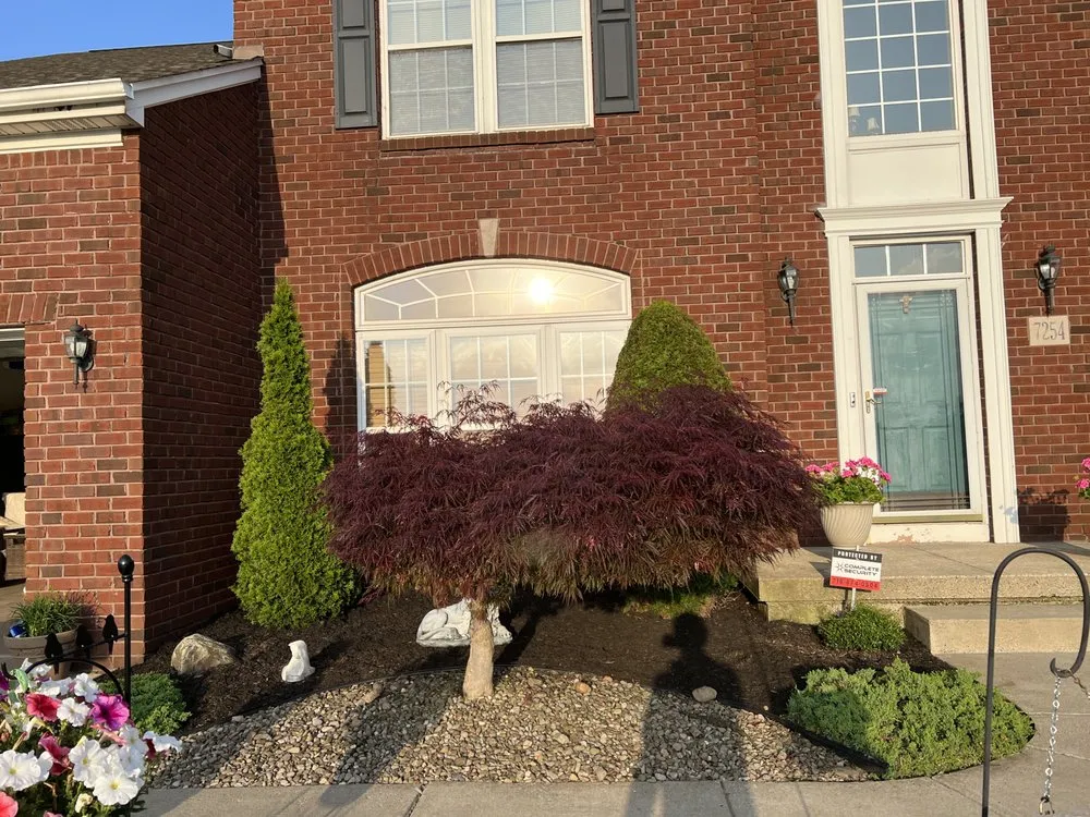 Local yard maintenance with custom design in Getzville, NY by D Plus Landscaping