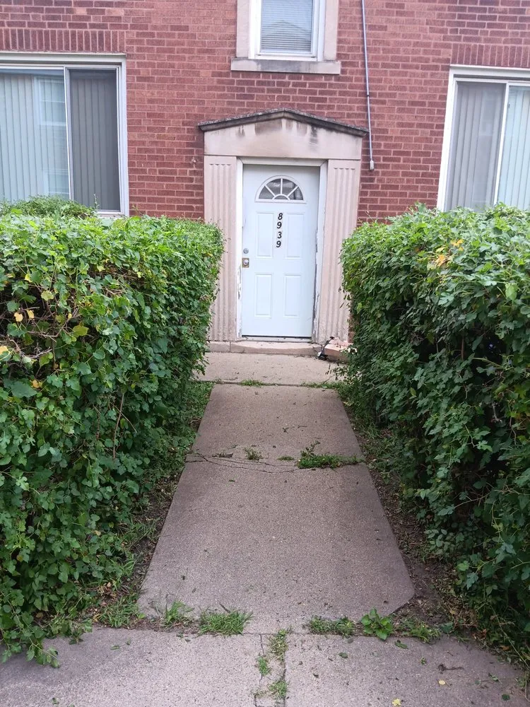 Expert landscaping services for residential properties in Normal, IL by Dahu's Maintenance