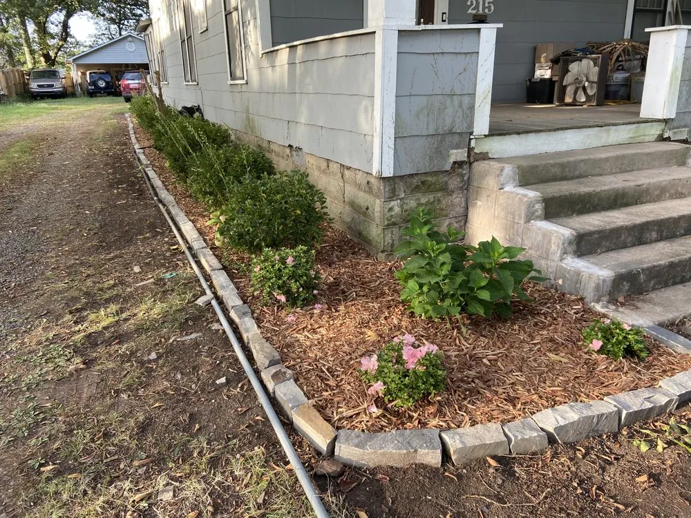 Custom landscape installation with custom design in Lorain, OH by Daisy's Lawncare & Snow Removal