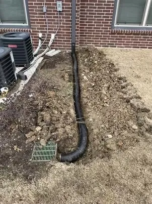 Professional lawn mowing service in Garland, TX by Dallas Drainage Pros