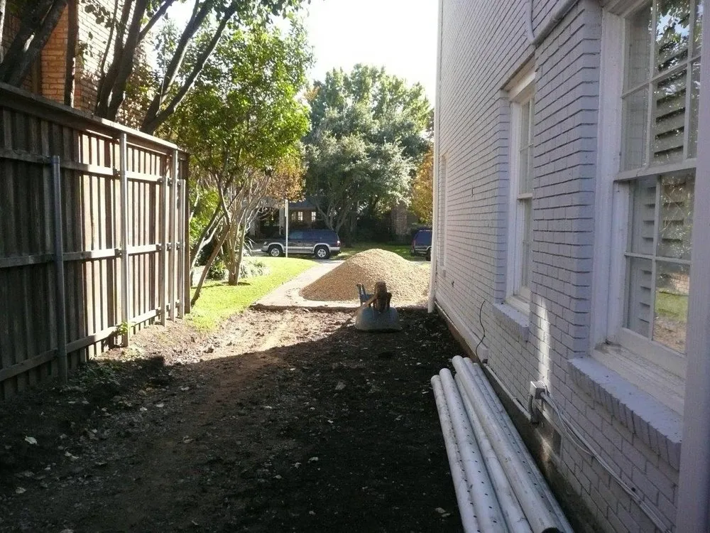 Professional lawn care service for residential properties in Dallas, TX by Dallas Drainage Solutions