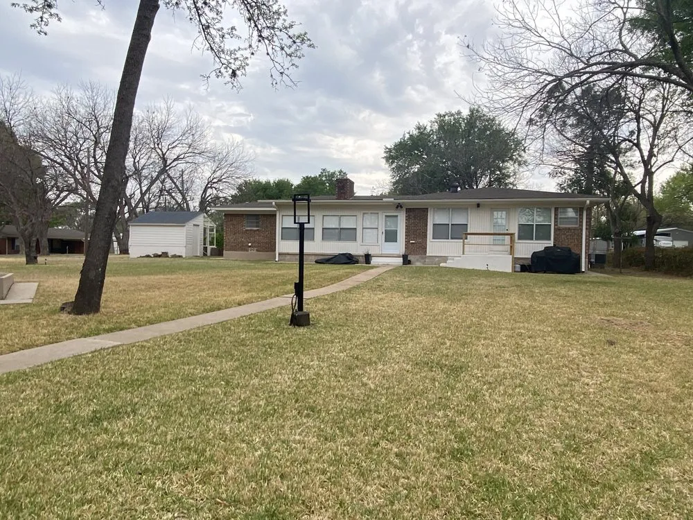 Professional yard cleanup service for year-round maintenance in Burnet, TX by Danna Tree & Lawn Service