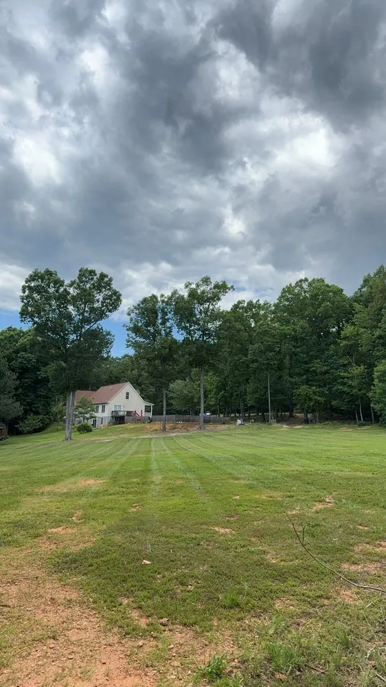 Professional yard maintenance for homes in Palmyra, VA by Danny’s land