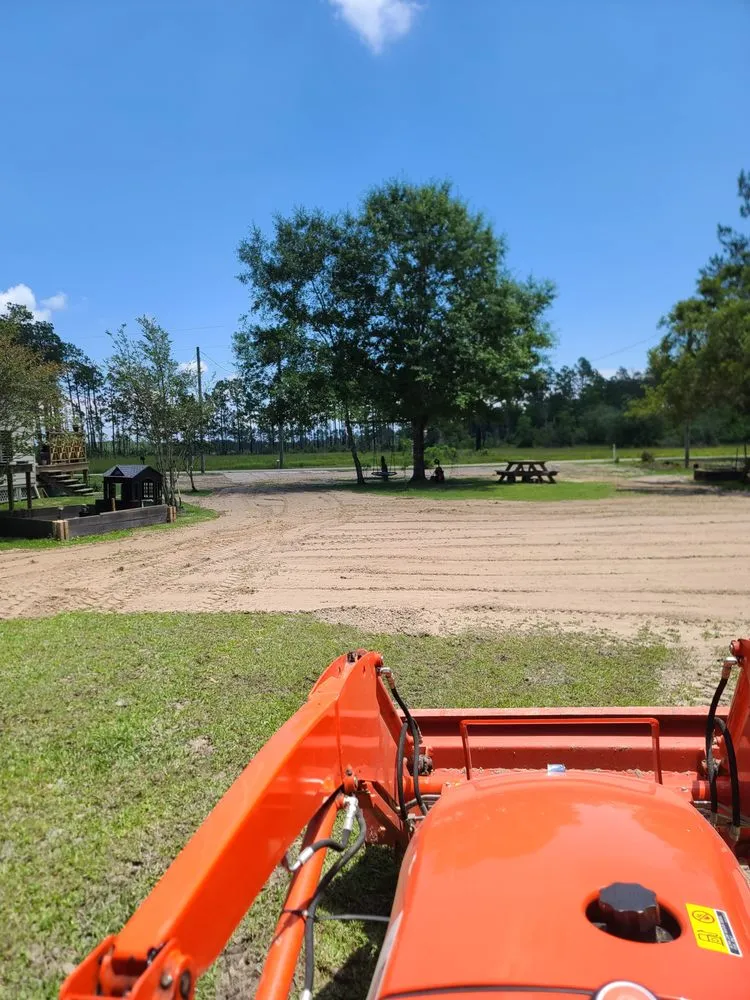 Custom landscape design for beautiful yards in Bay St. Louis, MS by Danos Lawn Service & Tractor Work