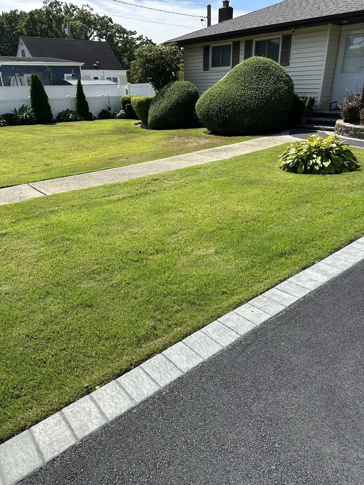 Custom yard maintenance for beautiful yards across Bay Shore, NY - Dark Green Landscaping