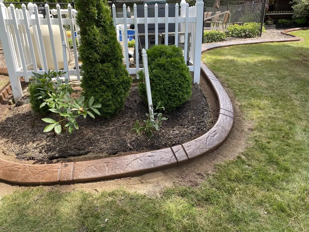 Trusted yard maintenance with custom design in Lockport, NY by Dave’s Decorative edging & Landscaping