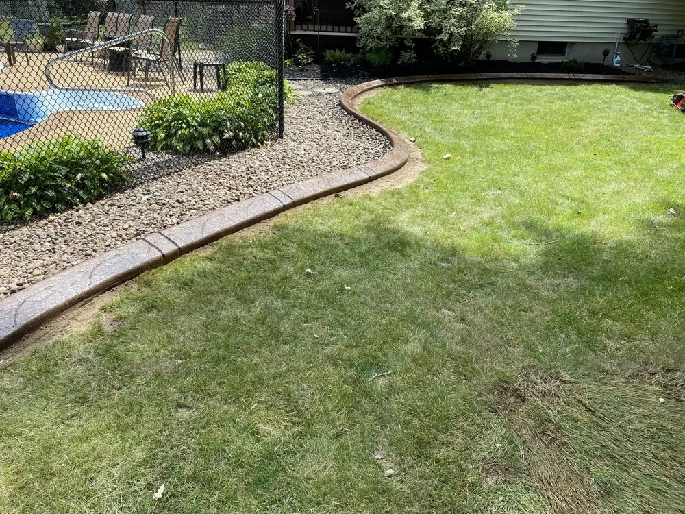 Expert garden landscaping with custom design across Lockport, NY - Dave’s Decorative edging & Landscaping