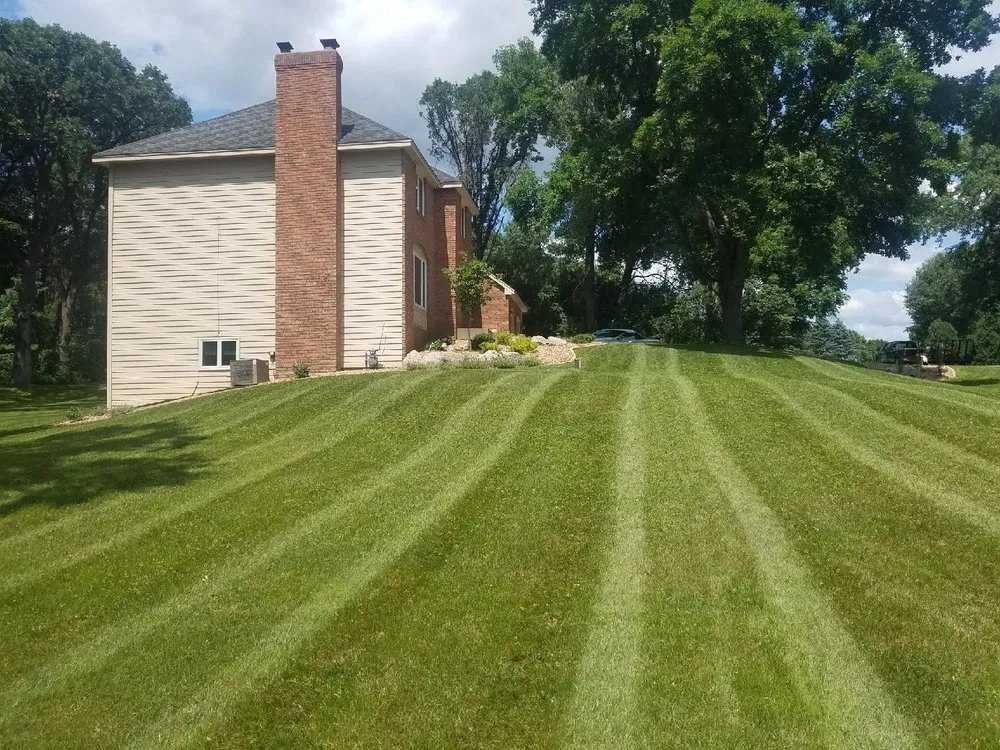 Expert landscaping services for homes in St Paul, MN by Dave's Green Thumb Lawn Care