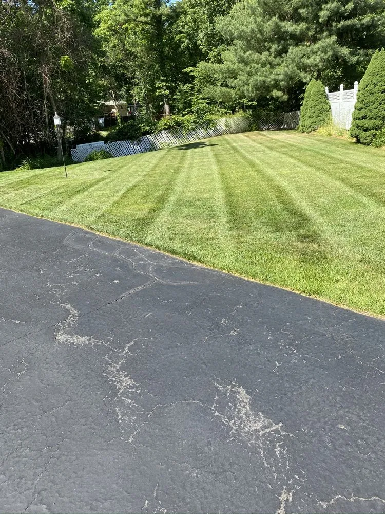Custom yard cleanup service for year-round maintenance in Worcester, MA by Davis Landscaping