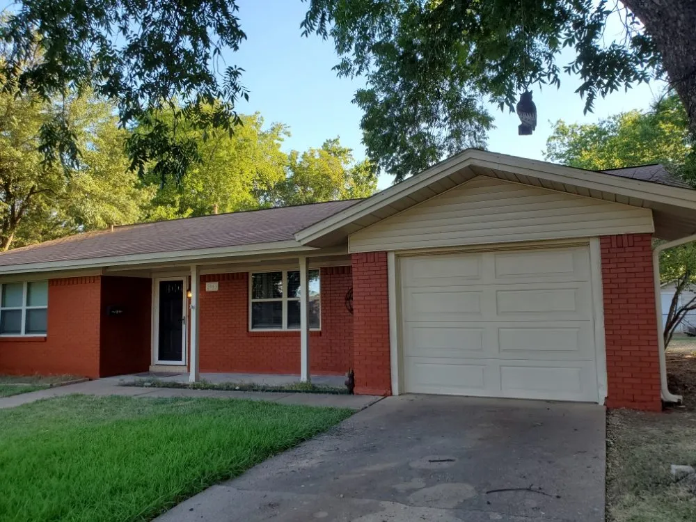 Custom yard cleanup service for year-round maintenance in Brownwood, TX by DCC