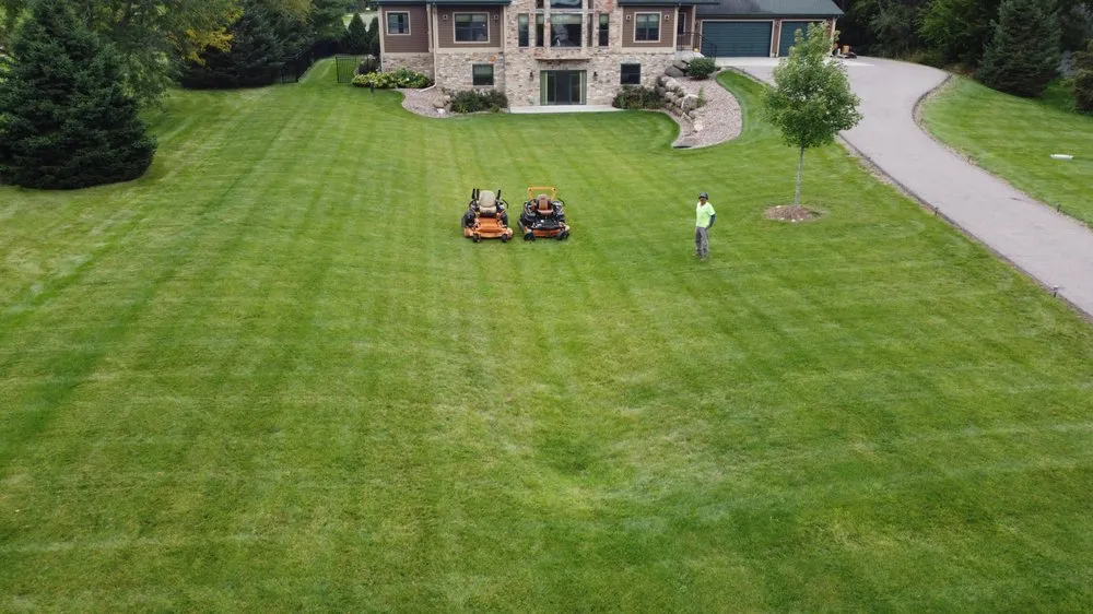 Custom lawn mowing service for year-round maintenance in Madison, WI by DE Green Ideas