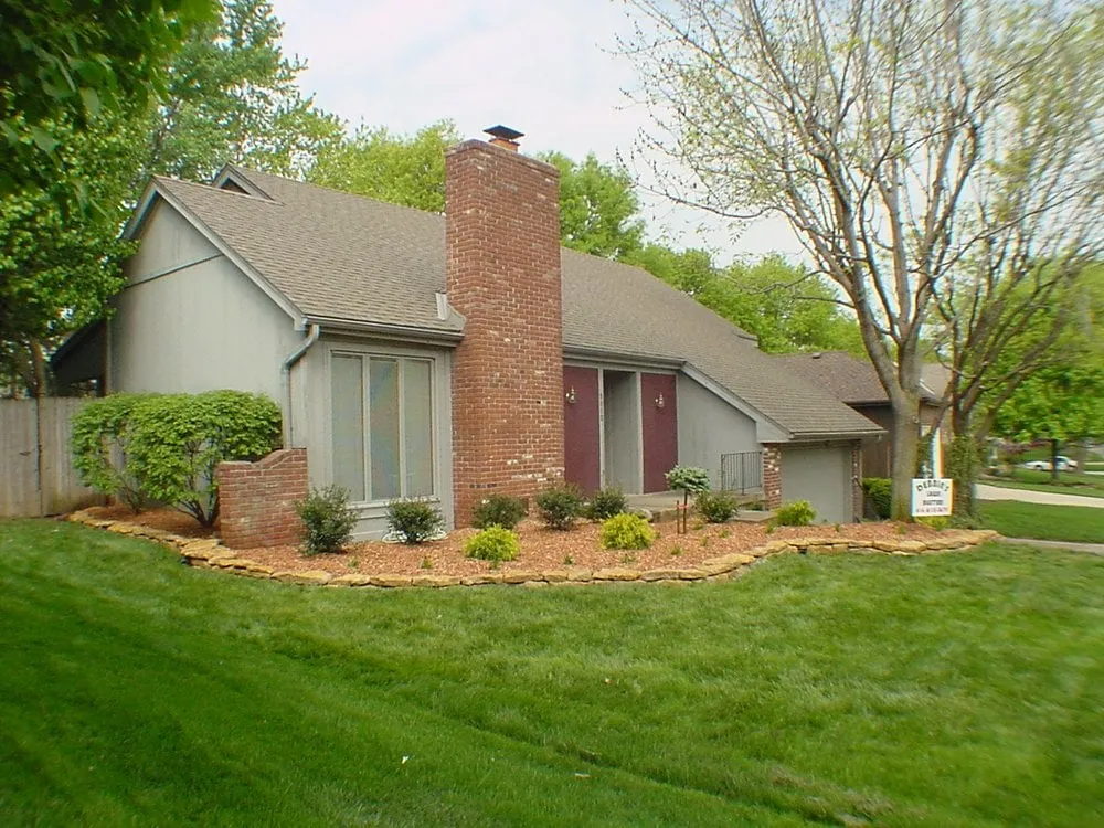 Custom outdoor landscaping for homes across Cleveland, MO - Debbie's Lawn Busters